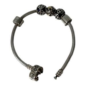 Pandora bracelet with 3 charms & two stoppers ‘K’ initial charm & 2 swirl charms